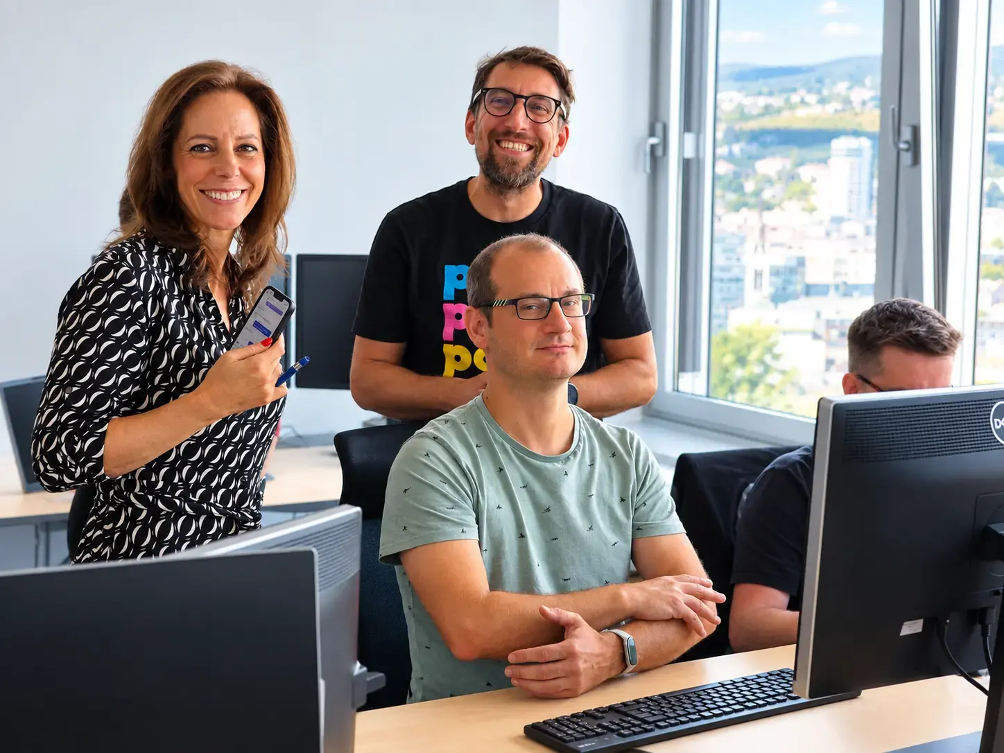 Whitestein engineers at their desks in the Bratislava office